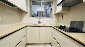 Fridge, stovetop, cookware/dishes/utensils, dining tables