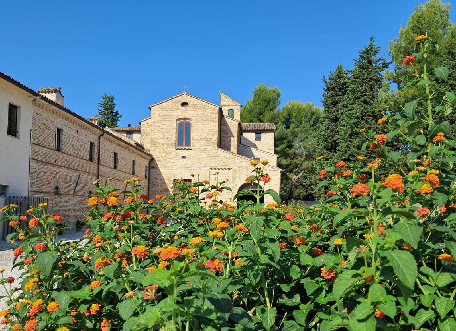 A building with a traditional architectural style, featuring a prominent central tower and a symmetrical facade.