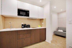 Fridge, microwave, stovetop, coffee/tea maker