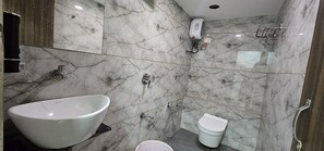 Deluxe Double Room, City View | Bathroom | Shower, free toiletries, slippers, towels - Hotel Nest View In (Ahmedabad)