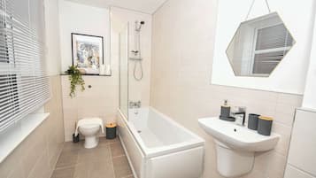 Shower, hair dryer, towels, shampoo