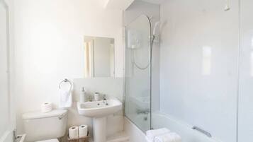 Shower, hair dryer, towels, shampoo