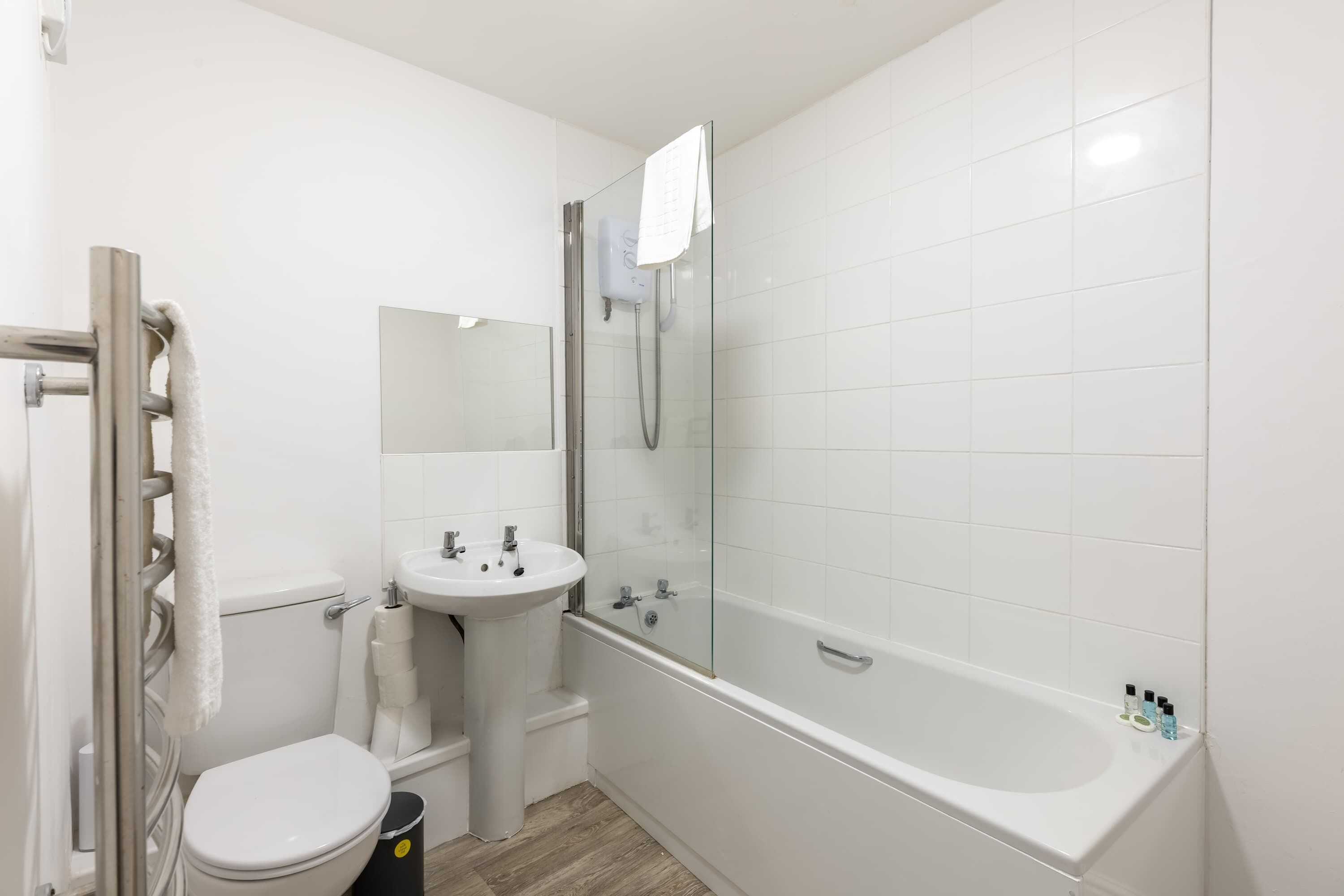Shower, hair dryer, towels, shampoo