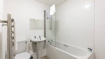 Shower, hair dryer, towels, shampoo