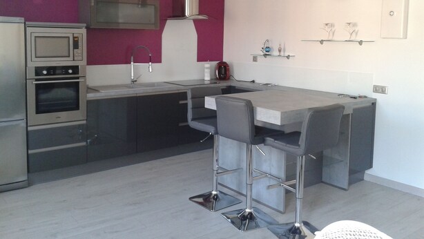 A modern kitchen with a built-in oven, microwave, and stainless steel appliances. - Holiday in the Sun and Sea, Apartment on 1st or 2nd floor! (Elne)