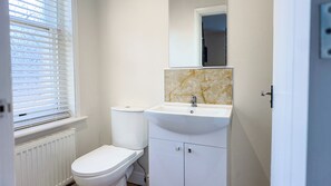 Shower, rainfall showerhead, hair dryer, towels