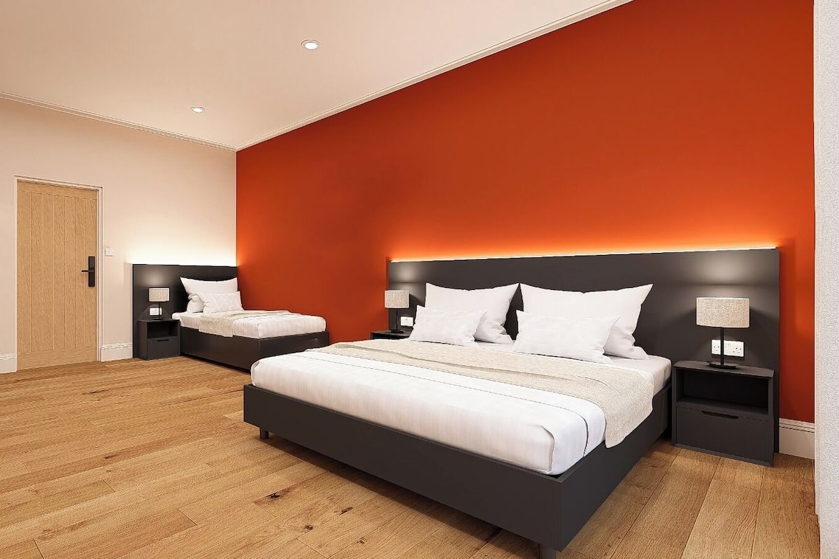 Desk, laptop workspace, iron/ironing board, travel cot