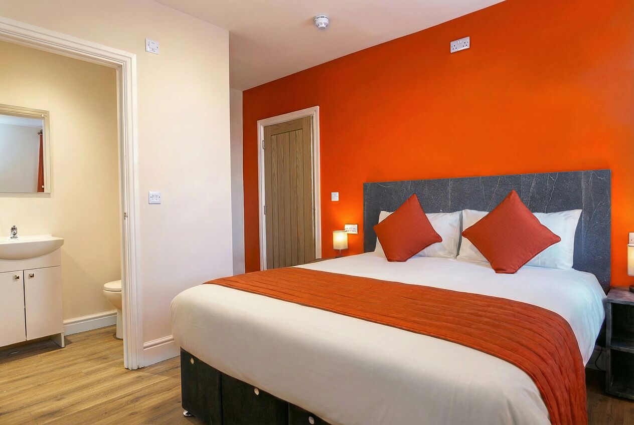 Desk, laptop workspace, iron/ironing board, travel cot