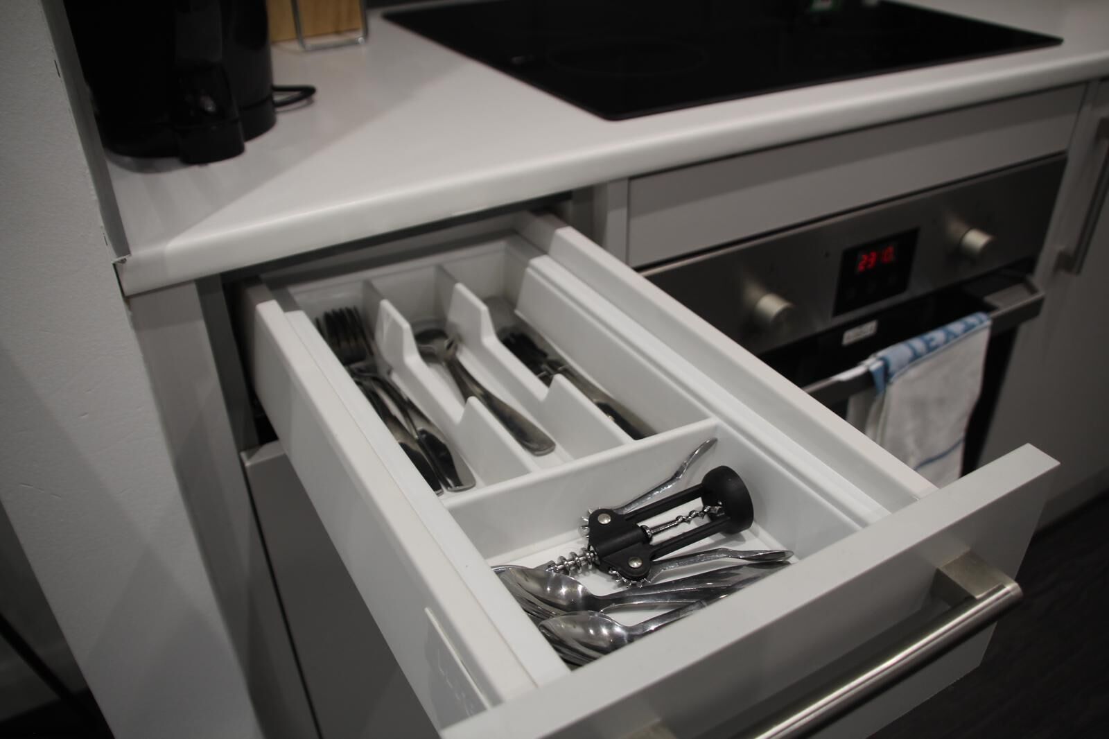 A kitchen drawer with utensils.