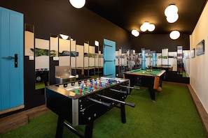 A room with a foosball table, a pool table, and a blue door. - Villa Peaceful Valley With Heated Pool (Sestanovac)