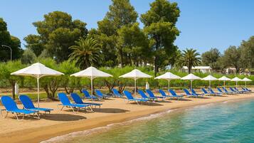 On the beach, sun loungers, beach umbrellas, beach towels