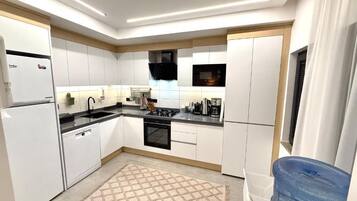 Family Suite, City View | Private kitchen