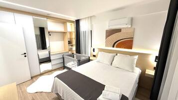 Family Suite, City View | In-room safe, blackout curtains, iron/ironing board, free WiFi