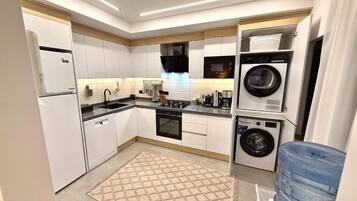 Family Suite, City View | Private kitchen