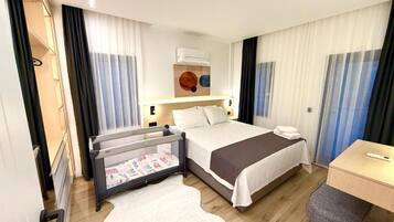 Family Suite, City View | In-room safe, blackout drapes, iron/ironing board, free WiFi