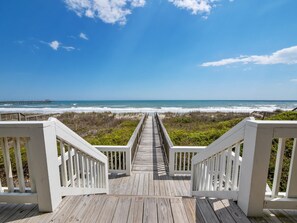 A wooden boardwalk leading to the beach with white railings. - Beachfront Retreat w/ Pvt Hot Tub & Sunrise Views (North Topsail Beach)