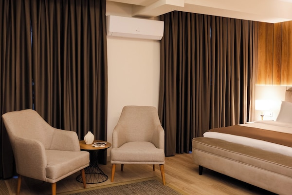 Deluxe Double Room, Balcony | In-room safe, desk, laptop workspace, blackout curtains