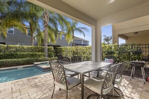 Outdoor dining - 520 - 8BD Home Pool/Spa - Movie & Game room (Kissimmee)