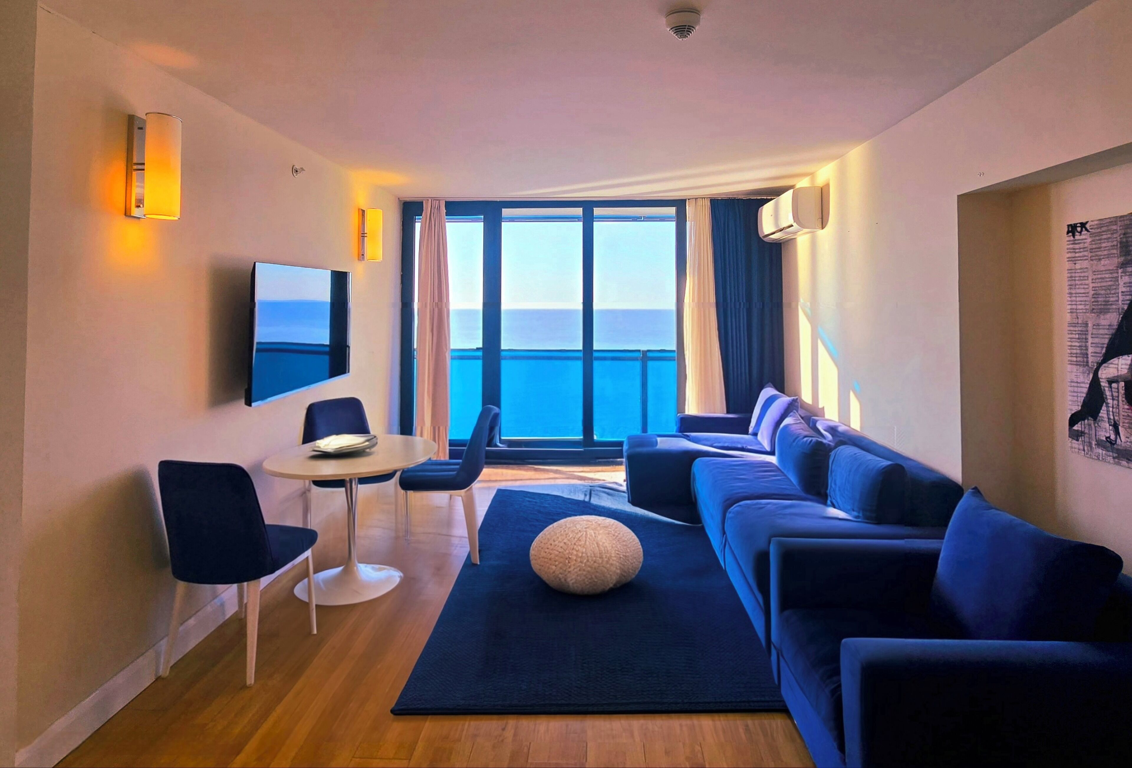 Deluxe Suite | Living area | 49-inch Smart TV with digital channels