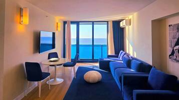 Deluxe Suite | Living area | 49-inch Smart TV with digital channels