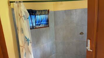 Shower, towels, soap, toilet paper