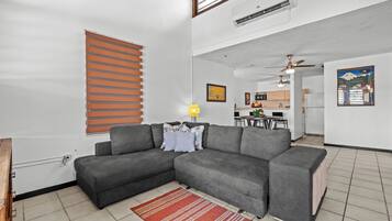 Deluxe Apartment, Balcony | Living area | 32-inch flat-screen TV with digital channels
