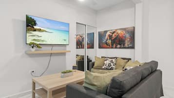 Apartment, 3 Bedrooms | Living area | 32-inch flat-screen TV with digital channels