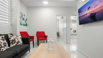 Apartment, 2 Bedrooms | Living area | 32-inch flat-screen TV with digital channels
