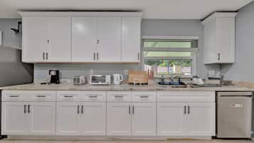 Microwave, toaster, cleaning supplies, freezer