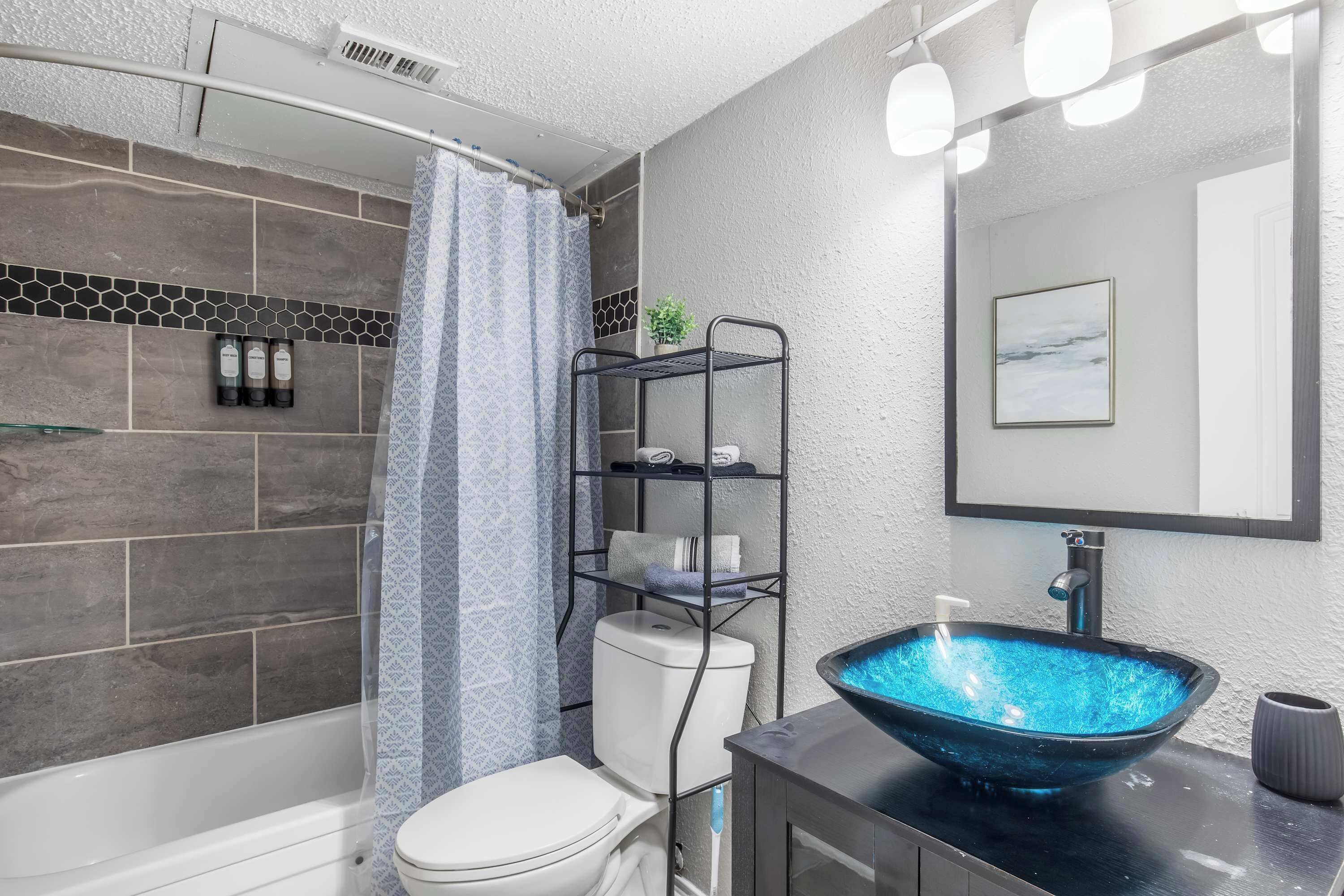 Shower, hair dryer, towels, shampoo