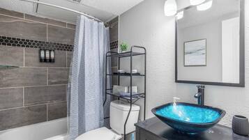 Shower, hair dryer, towels, shampoo