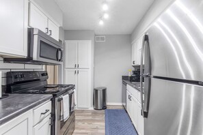 Fridge, microwave, oven, stovetop - Walk to AT&T Stadium - Modern 2BR Game Day Stay (Arlington)