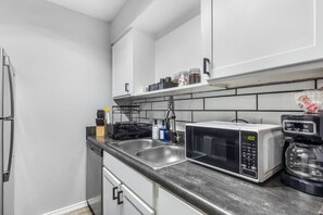 Fridge, microwave, oven, stovetop - Walk to AT&T Stadium | Modern 1BR Game Day Stay (Arlington)