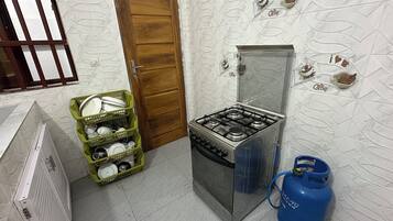 Fridge, microwave, stovetop, cookware/dishes/utensils