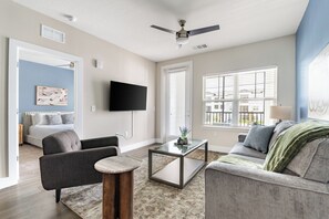 Apartment (1 Bedroom) | Living area | 50-inch TV with digital channels - Landing Furnished Apartments Near MCO (Orlando)
