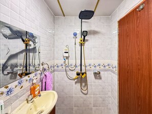 Shower, hair dryer, towels, soap