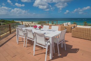Outdoor dining - Oceanfront Penthouse with Private Rooftop Pool (Oranjestad)