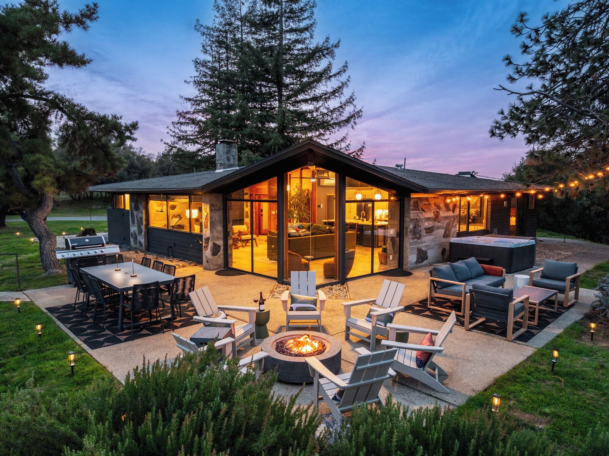Gather round after dark — the fire pit glows against the Sierra backdrop while the mountains go quiet and the stars take over.