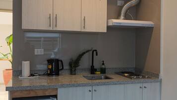 Fridge, coffee/tea maker, electric kettle, cookware/dishes/utensils