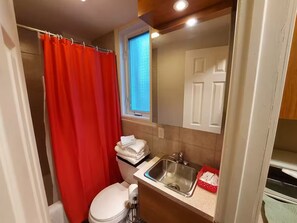 Shower, hair dryer, towels, soap