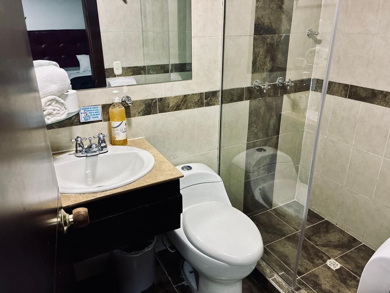 Shower, towels, soap, toilet paper