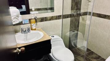 Shower, towels, soap, toilet paper