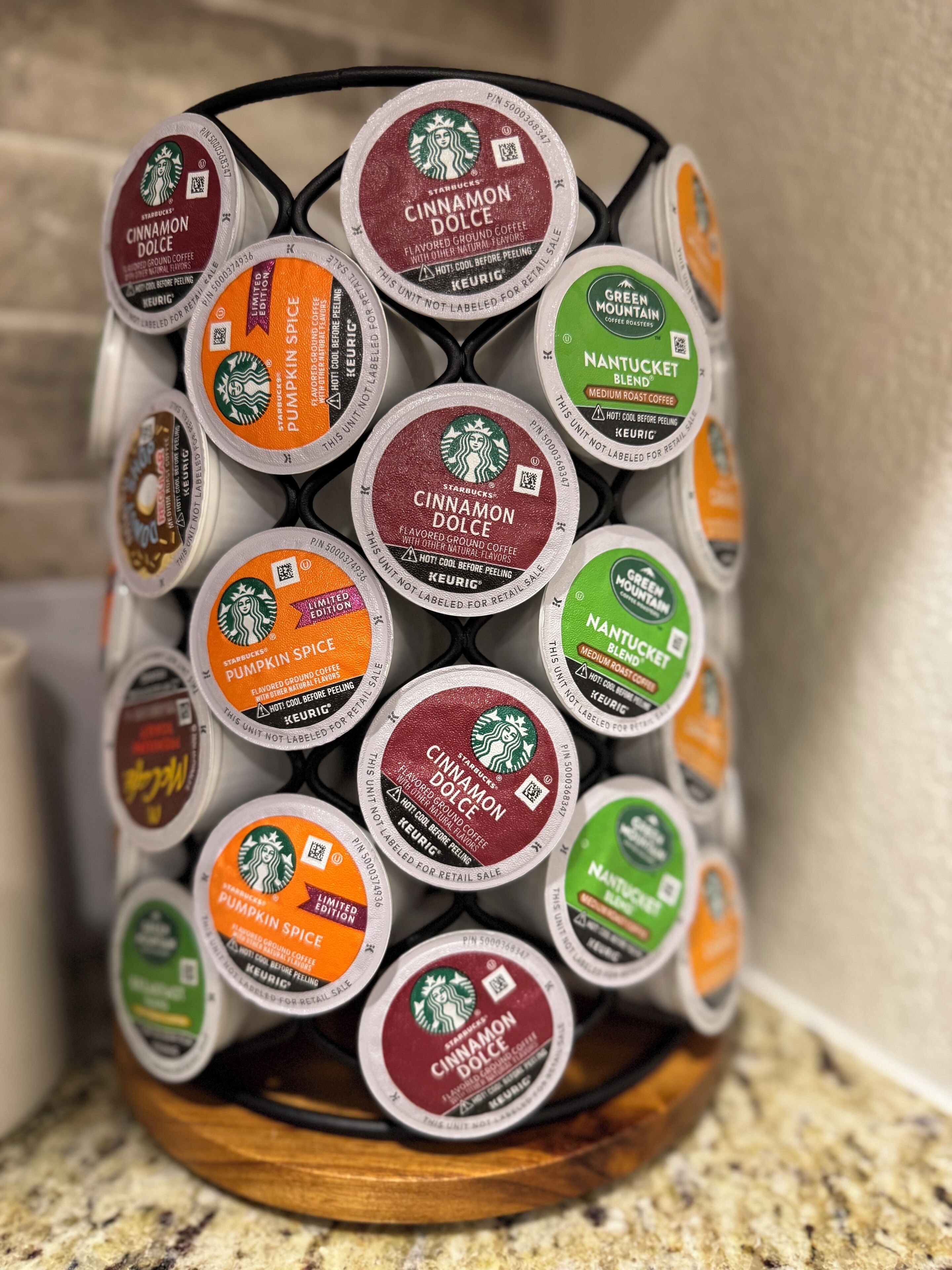 A coffee pod holder with various Starbucks flavors.