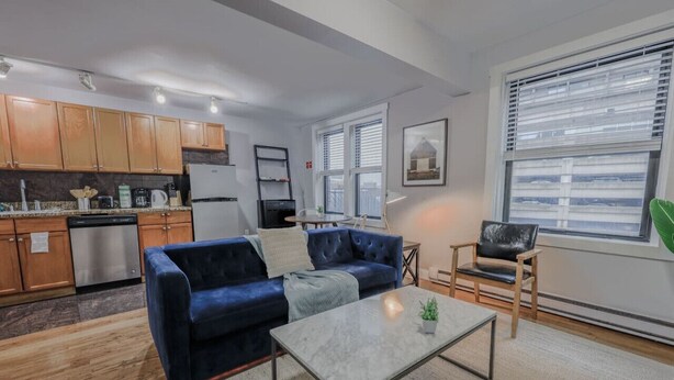 A modern apartment with a living area, kitchen, and dining space. - Theater District Cozy 1 BR! (Boston)