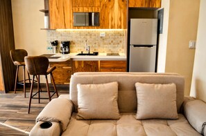 Deluxe Apartment, Partial Sea View | Living area | Flat-screen TV - CARIBIQUE (Playa del Carmen)