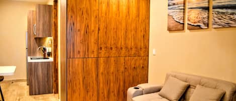 Estudio Deluxe, vista al mar | Área de sala de estar