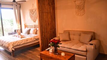 Departamento Deluxe, vista al mar | Área de sala de estar