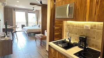 Deluxe Apartment, Sea View | Private kitchen | Coffee/tea maker, fridge, microwave, stovetop