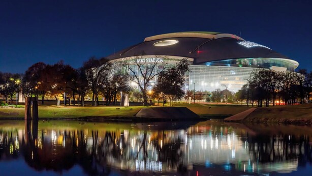 A stadium with a large circular roof and a reflection in the water in front. - Full Family Stay Near At&t, Ballpark, 6 Flags & Airport (Grand Prairie)
