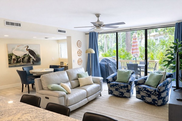 Living room with patio and pool access